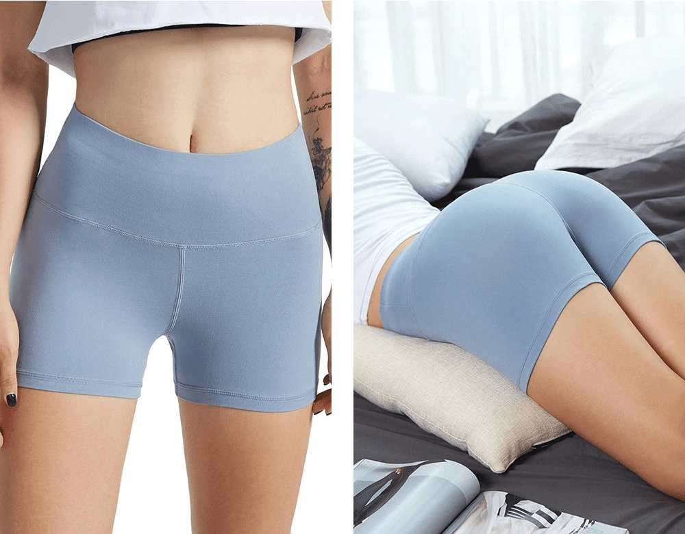 Sporty elastic blue women's short shorts for training, showing high waist and flexible fit. Ideal for comfort during workouts.